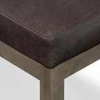 SIMPLIHOME Milltown 27" Wide Vegan Leather Ottoman in Distressed Brown | Contemporary ottoman with a cushioned seat for bedroom seating; rectangle footstool, footrest or bench.