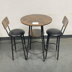 23.6" 3 Piece Round Bar Table and Chair Set with Shelf Rustic Brown | Rustic Brown Particleboard And Black Steel Frame With Integrated Middle Storage Shelf For Small Spaces