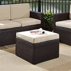 Pemberly Row Wicker Patio Ottoman, Brown Finish with Sand Cushions, Resin Wicker and Steel Frame, UV/Fade Resistant, 23" W x 23" D x 17.5" H, Outdoor Footrest for Deck, Patio, or Garden Use