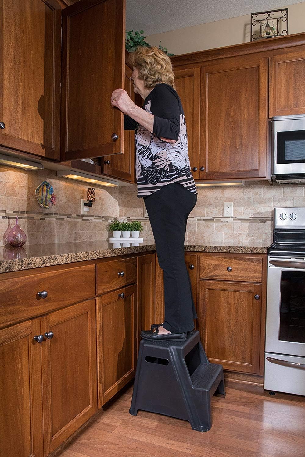Rubbermaid 2-Step Plastic Stool, 300 lb Capacity, Lightweight, Black | Slip-resistant treads, Non-marring feet, Large standing platform, Cutout carry handles, No assembly required