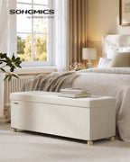 SONGMICS Storage Ottoman Bench with Legs, 43.3 Inches, 30 Gal. (112 L) | Bench with Legs, Velvet, for Living Room, Entryway, Cappuccino Beige and Ink Black, MELISA Collection ULSF0518W02