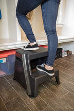 Rubbermaid 2-Step Plastic Stool, 300 lb Capacity, Lightweight, Black | Slip-resistant treads, Non-marring feet, Large standing platform, Cutout carry handles, No assembly required