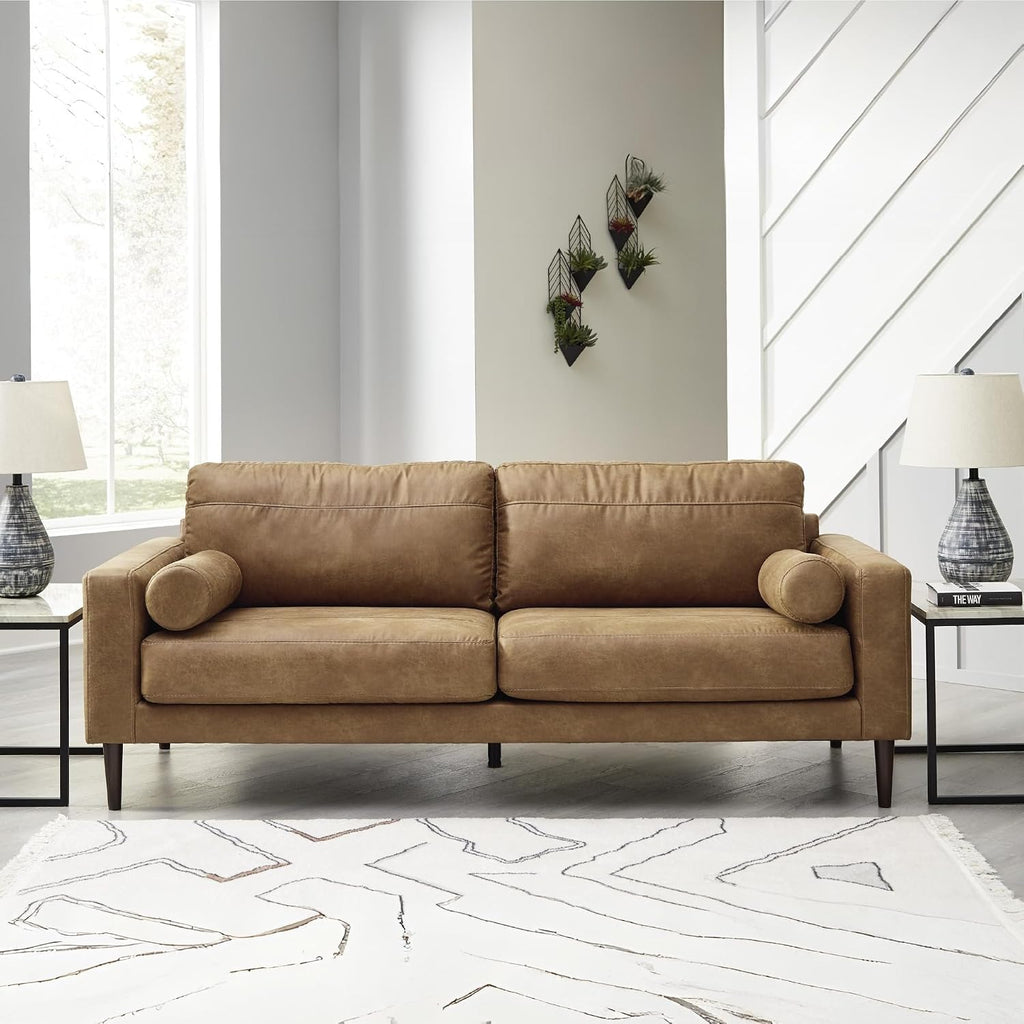 Signature Design by Ashley Telora Faux Leather 3 Seater Sofa Couch, Caramel | Medium plush fiber-wrapped foam seating, Track arms, Loose back cushions, Mid-century modern style