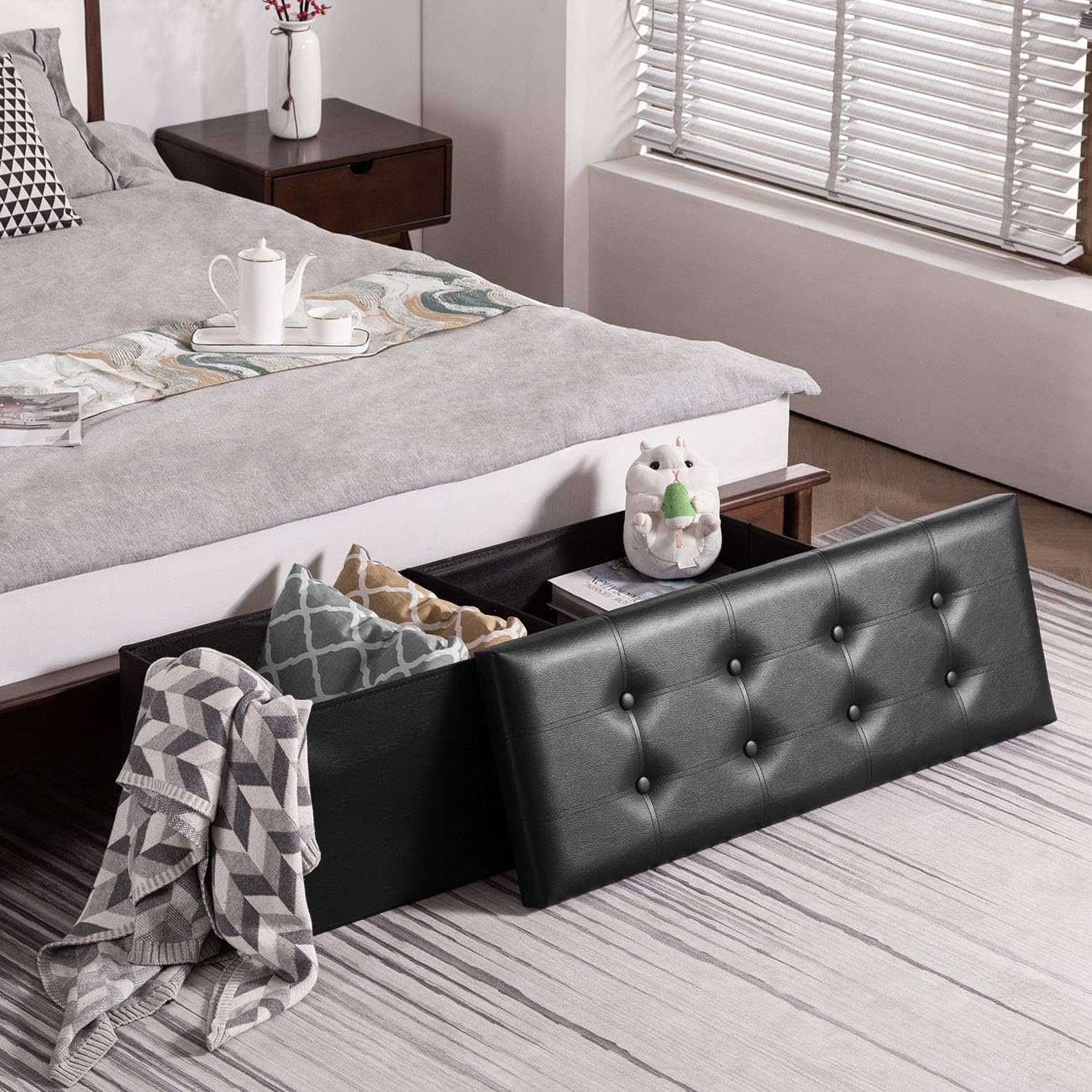YOUDENOVA 43" Ottoman with Storage, Folding Faux Leather Bench, Black | Foldable ottoman with hidden storage, padded faux leather seat and sturdy MDF frame for everyday use.