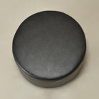 KINWELL Modern Faux Leather Round Upholstered Ottoman, Multi-Functional Sofa Footrest, Side Table, Extra Seating for Living Room, Bedroom (Black, 24" D x 24" W x 13" H)