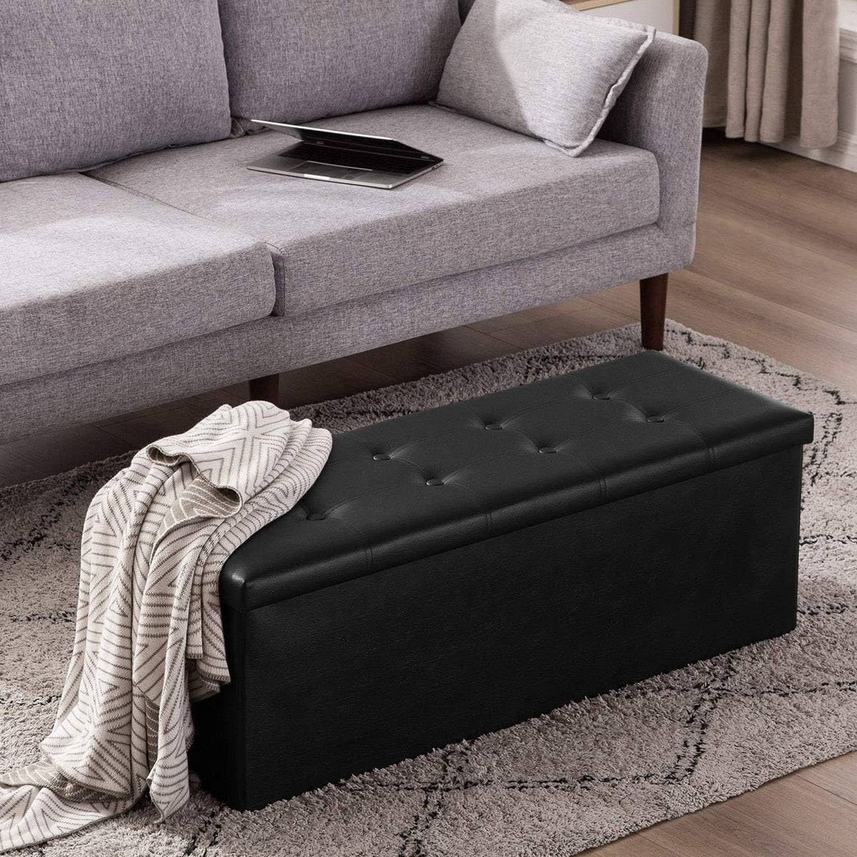 YOUDENOVA 43" Ottoman with Storage, Folding Faux Leather Bench, Black | Foldable ottoman with hidden storage, padded faux leather seat and sturdy MDF frame for everyday use.