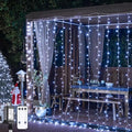 JMEXSUSS 900LED Christmas Curtain Lights, 9.5x29.5ft White Indoor/Outdoor Plug-in with Remote, Window Hanging String Lights for Bedroom, Wedding, Xmas Decoration