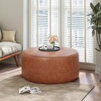 Merax 30.25" Modern Upholstered Round PU Leather Ottoman, Multifunctional Extra Seat, Side Table, Foot Rest, Stuffed Pouf Footstool for Living Room Bedroom, Cognac Brown