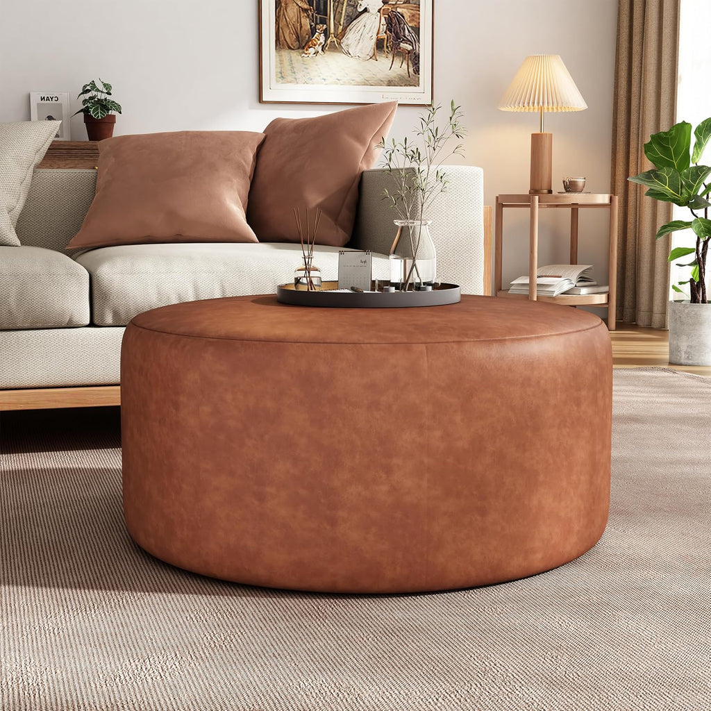 Merax 30.25" Modern Upholstered Round PU Leather Ottoman, Multifunctional Extra Seat, Side Table, Foot Rest, Stuffed Pouf Footstool for Living Room Bedroom, Cognac Brown